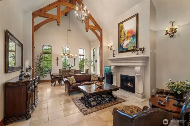 Radiant floor heating and custom limestone mantel surround the propane fireplace.