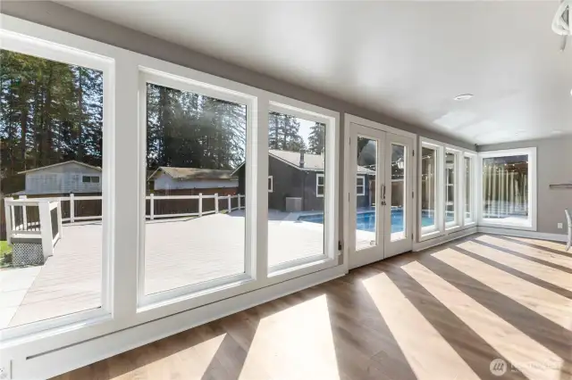 Sunroom backs up to the kitchen bar.