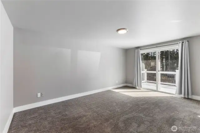 Second floor primary suite with access to a balcony overlooking the pool.