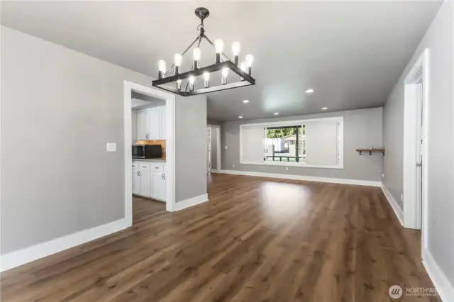 Formal dining room just off the kitchen and third living space.