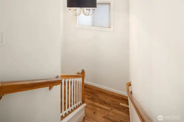 Upstairs, the primary suite features a beautifully remodeled ensuite bath with a spa-inspired shower. Three additional bedrooms provide flexible space for guests, a home office, or hobbies.