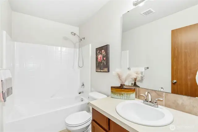 Lower level guest bathroom with full bath