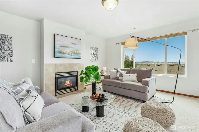 Expansive living room design with gas fireplace and beautiful view outlook