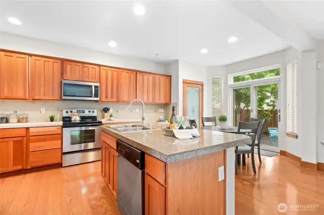 Kitchen eating area located next to slider door to backyard.