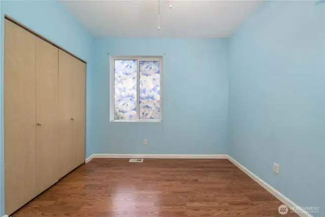 Bedroom #2 - showing the wall of closet space.