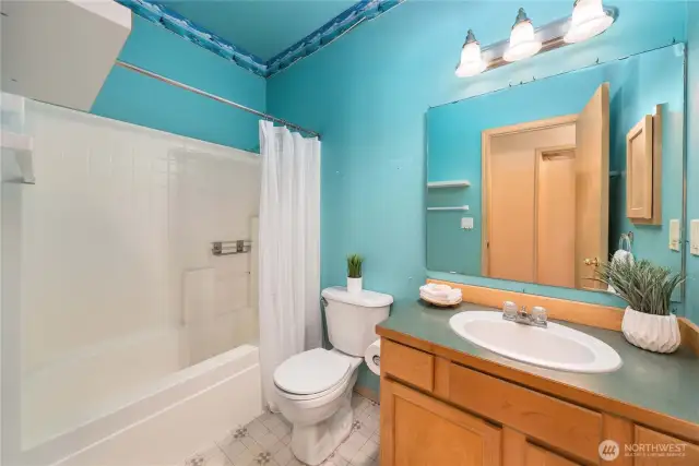 Full bath located in the hall near Bedroom #2 and the office.