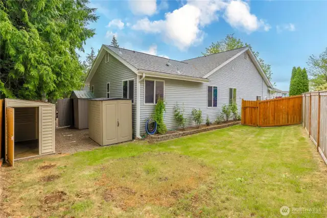 Three storage sheds stay with the property!