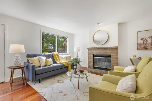 Wonderful great room with wood-burning fireplace, French doors, smart layout, and dining room area!