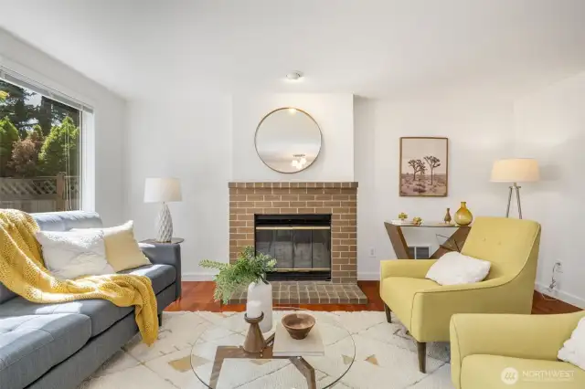 Wonderful great room with wood-burning fireplace, French doors, smart layout, and dining room area!