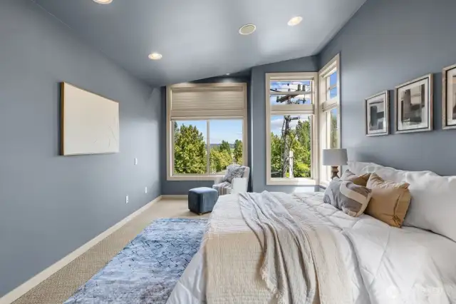 Large picture windows in the primary bedroom