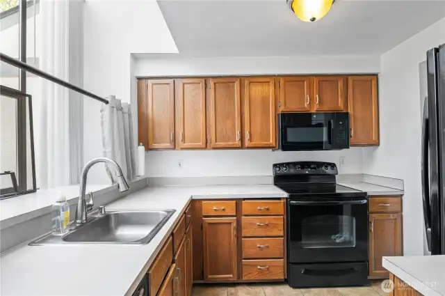 Sleek, black appliances in the kitchen.