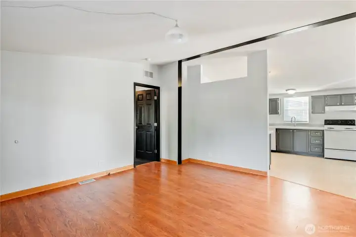 front living room, door leads to primary bedroom
