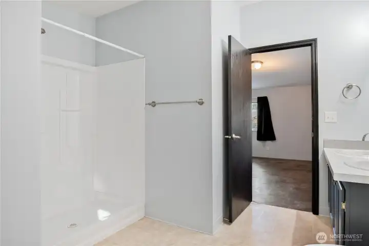 primary suite bathroom with shower