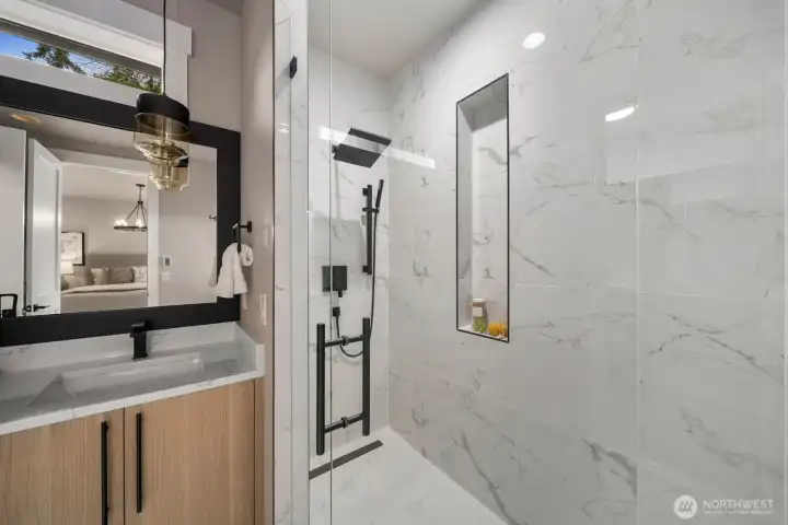 A beautifully designed shower in the primary bath.