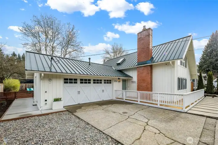 In addition to its inviting curb appeal, the home has received a series of meaningful system upgrades that enhance comfort and long-term reliability. The garage features a newer Chamberlain MyQ–enabled opener for smartphone access, along with a gas water heater replaced in 2015.  In the garage you will also find a long sturdy wood counter and shelving for your own workshop,  newer full sized Whirlpool washer and dryer, and a deep utility sink!   Throughout the property, the previous owner improved infrastructure with full copper repiping, replacing older galvanized lines for better pressure and long-term durability. The crawl space was also upgraded with new cast-iron sump pumps, equipped with battery backup, and a paved vapor barrier, supporting proper moisture control year-round.  Motion-sensor exterior lighting adds convenience and security around the home, creating a well-lit approach without the need for manual switches.