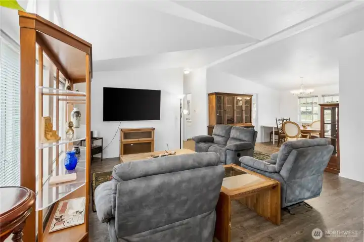 Open floor plan with laminate floorings and vaulted ceilings.