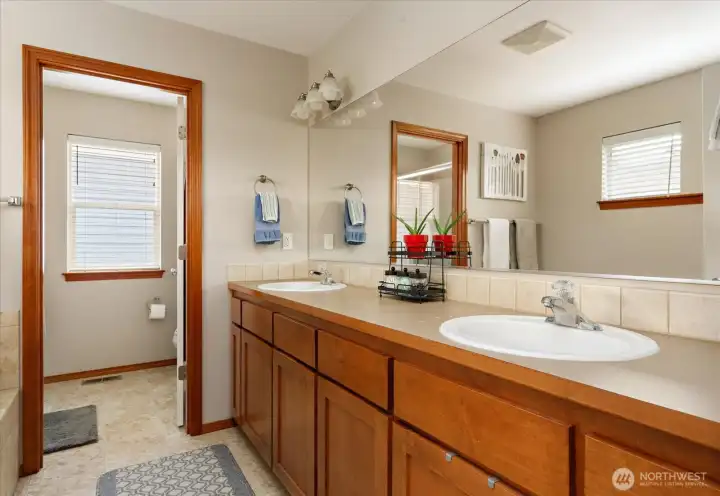 Enjoy the double vanity with ample storage cabinets.