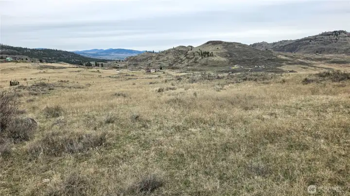 Shot looking South toward the main road. Power is at the property line. Ready for your vision with fantastic views and a cleared path to build.