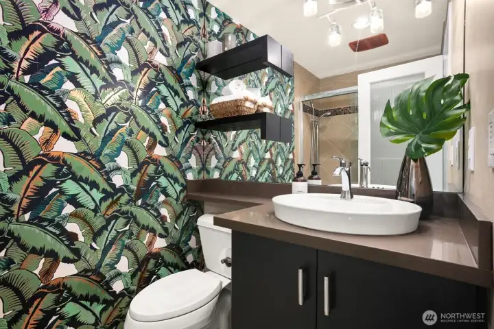 Main level full bathroom serves guests and two of the bedrooms.