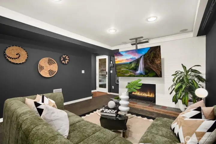 Downstairs to the lower level entertainment room with big-screen TV and surround sound for movie nights...