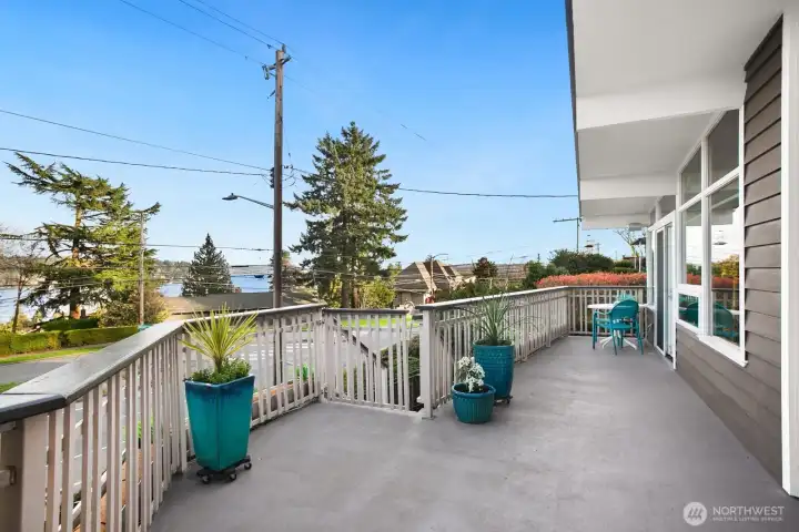 The deep front porch runs the full length of the house, with sweeping Lake Washington and Mt. Rainier (on a clearer day) views.