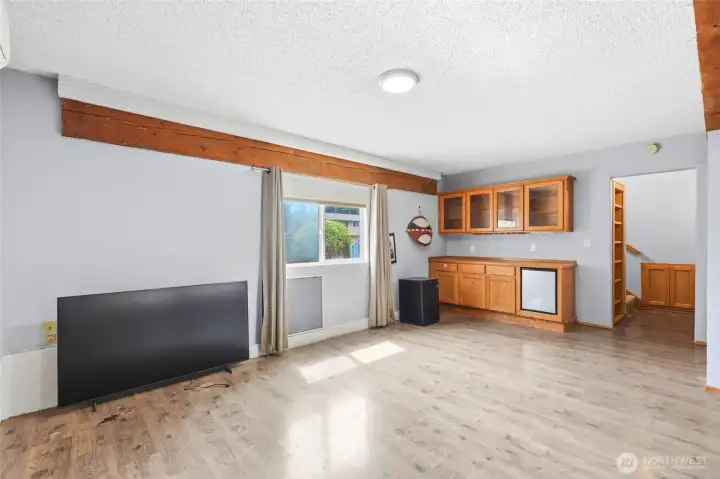 That bookcase secretly opens to storage and a wine rack.