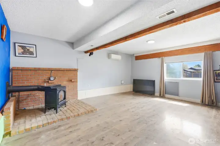 Natural gas stove, and mini split on wall. lower level