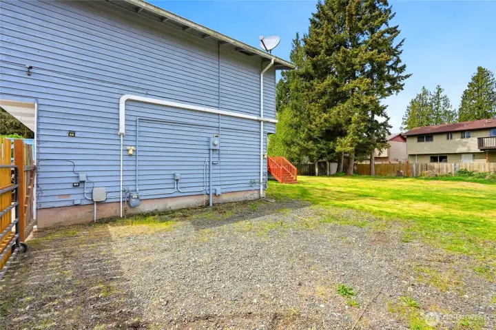 More RV parking? There is a regular 110v plug-in, and what appears to be a 220v plug, (untested) on this wall.