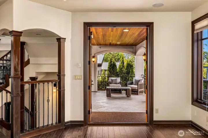 Main Floor Living Room: Hallway view showcasing the home's signature arched openings and thoughtful flow between roo