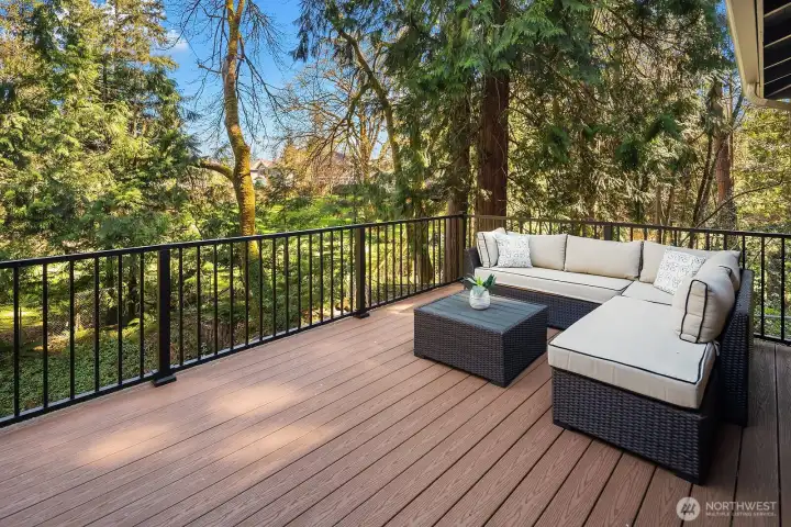 This inviting deck seating area is the ultimate outdoor retreat, offering a peaceful, tree-framed setting with complete privacy and a true connection to the natural beauty of the surrounding Pacific Northwest landscape. Whether hosting guests or enjoying a quiet evening, this space delivers effortless alfresco living at its finest.
