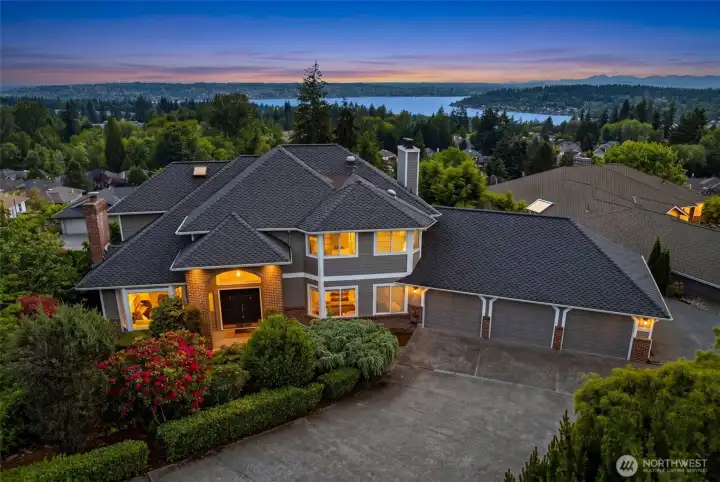 Lake Washington views, sunset skies, and timeless curb appeal welcome you home.