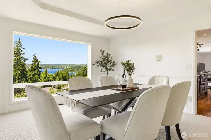 Detailed millwork and natural light frame the formal dining room, with the view as a beautiful backdrop while you dine.
