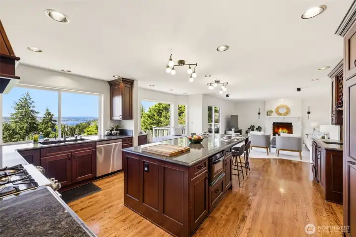Granite counters, gas cooking, and a spacious layout make this kitchen shine.