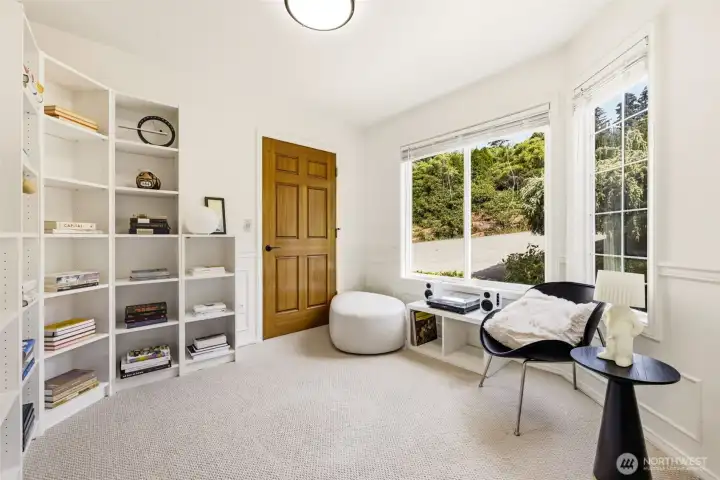The main level den is privately located near the entry and works well as an office or retreat.