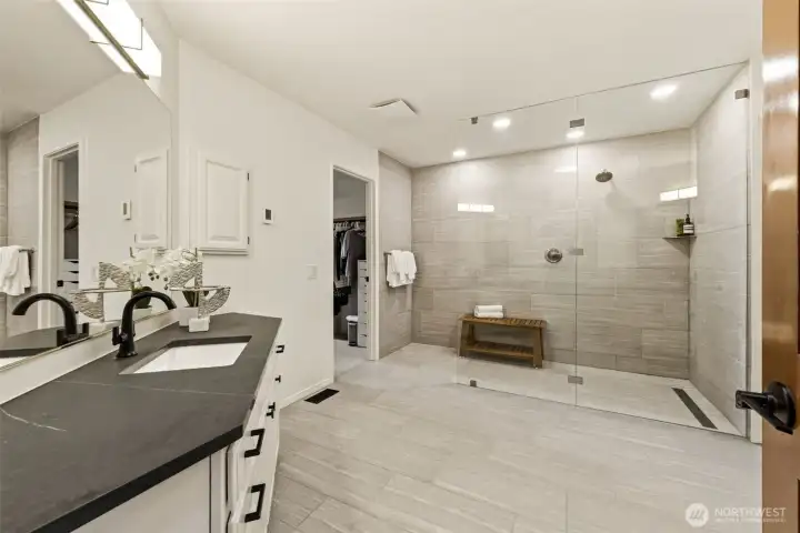 Dual vanities and generous space enhance the primary bath.