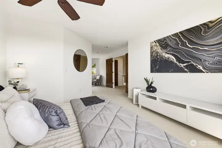 The primary bedroom offers generous scale and a calming retreat-like feel.