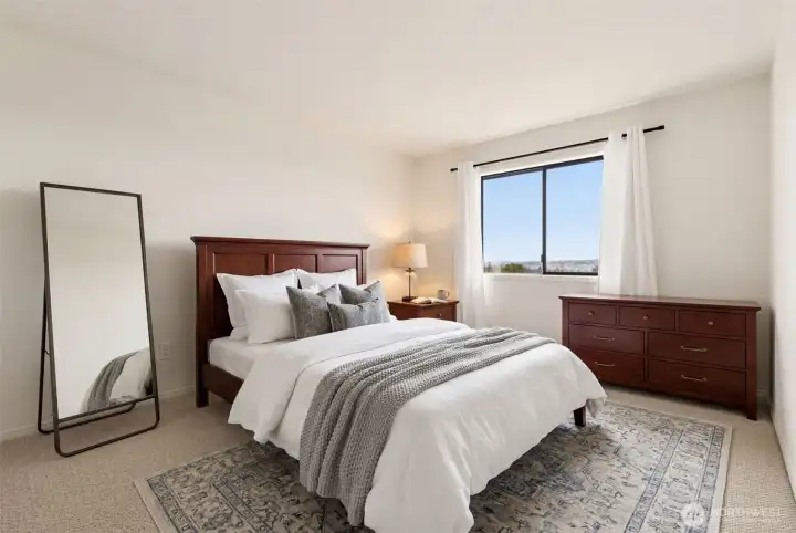 One of two additional upper-level bedrooms with great natural light.