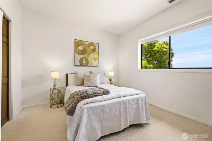 An additional lower-level bedroom adds room for guests, hobbies, or office use.