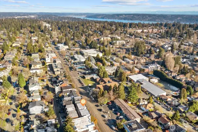 Aerial photo looking north. From this photo you can see Lake Washington. Sought after Wedgwood neighborhood 86 walk score & 81 bike score. Walking distance to grocery stores, cafes, and only minutes to Children's, UW, 520, downtown & Amazon! Located in #1 sought after school cluster!