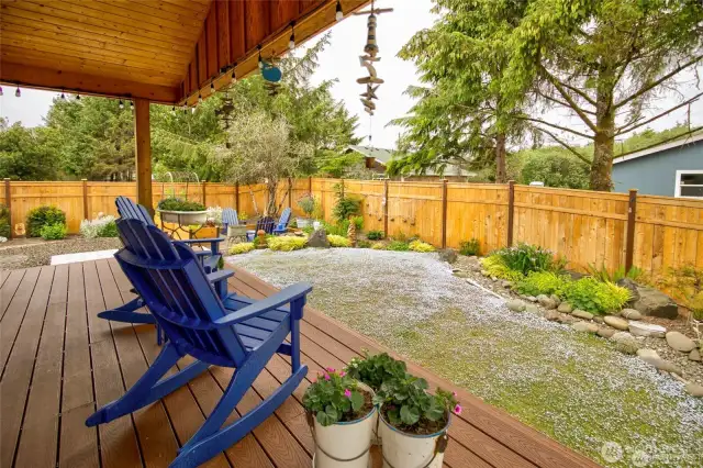Gorgeous covered TREX deck and professionally designed, low maintenance, fully fenced backyard