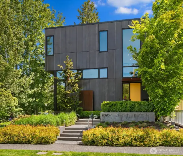 Custom built in 2014, this home is sited on a lush corner lot to take advantage of light & privacy.  Handsome, mature landscaping embraces the home.