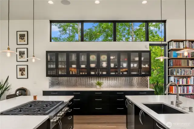 In the kitchen, you have a Sub Zero  refrigerator, a Miele dishwasher, a Wolf cooktop, warming drawer, steam oven, wall oven & downdraft vent.