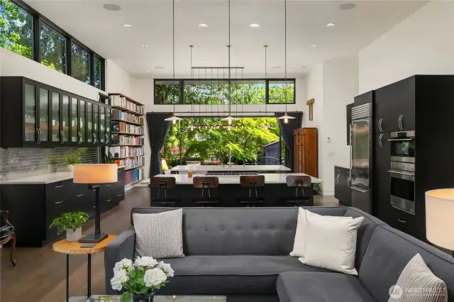 Looking straight down the living room through the kitchen/dining area out to the garden!