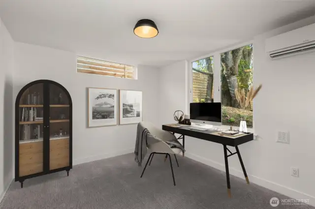 Lower-level bedroom offers privacy, comfort, and great natural light—ideal for guests, a home office, or flexible living.