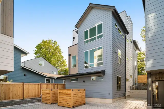 Private parking courtyard with designated and deeded electric vehicle capable space