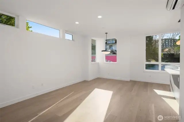 Sun-soaked living and dining flow into a beautifully finished kitchen, where form meets function in every detail.