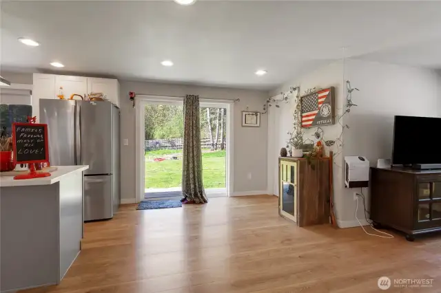 Slider to back yard off kitchen with family area to the right.