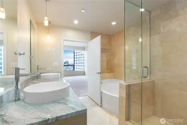 Soaking tub + large walk-in shower.