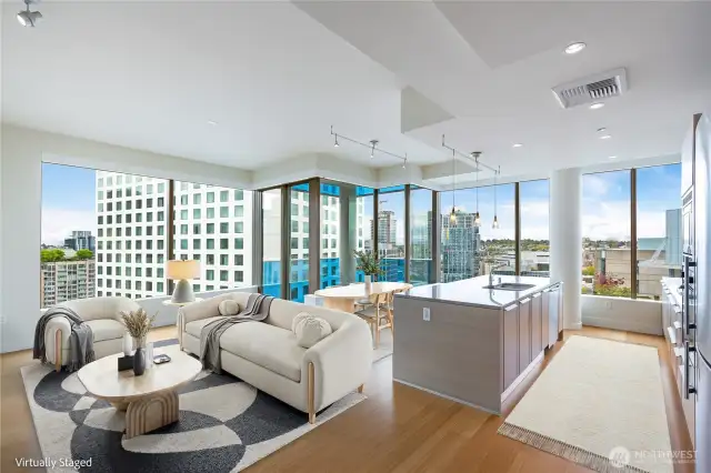 Wide open kitchen/living/dining spaces. (virtually staged)
