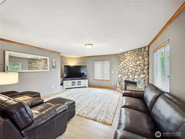 Off the kitchen is a large cozy family room with gas fireplace.